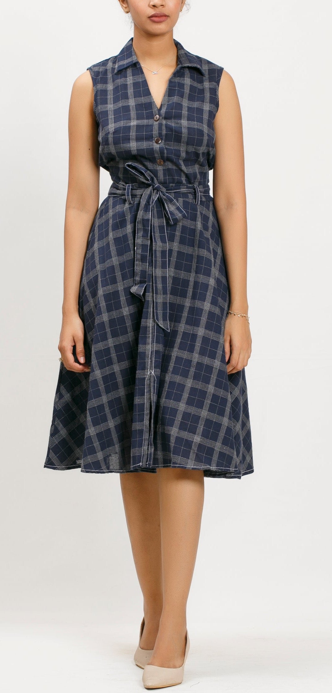 Amaro sleeveless collared top with coconut shell buttons and Waist tie