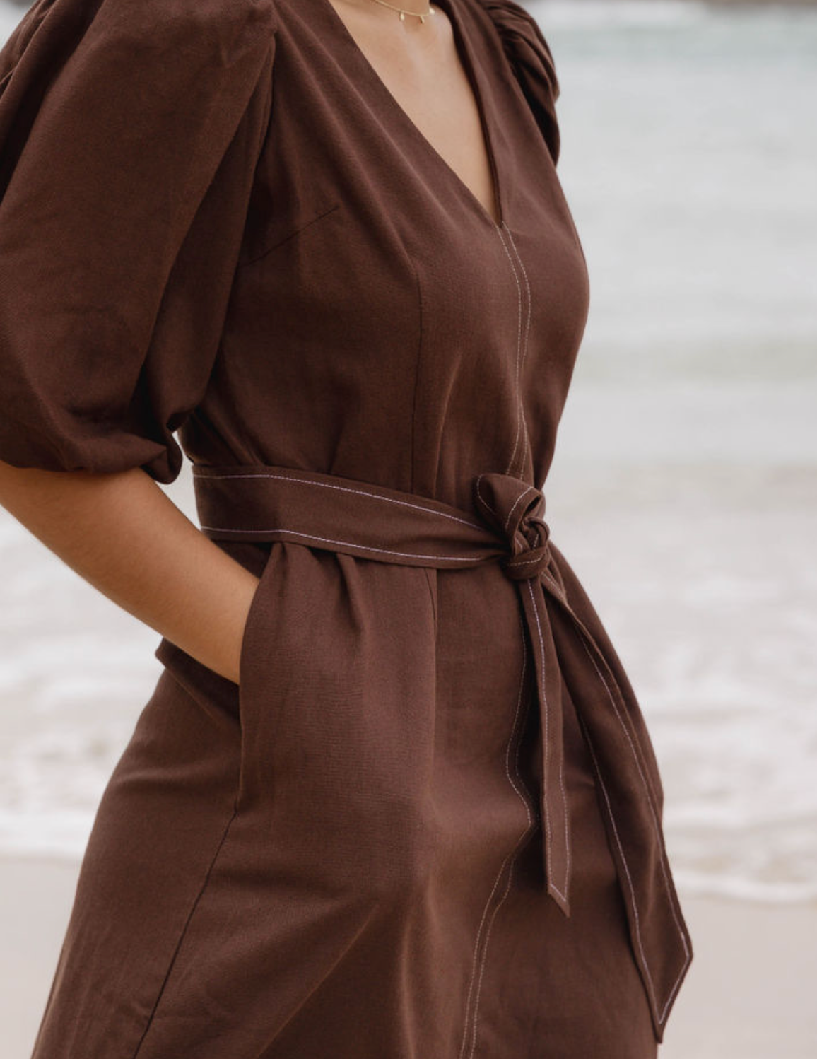 Puff sleeve brown midi dress with v-neckline and waist tie